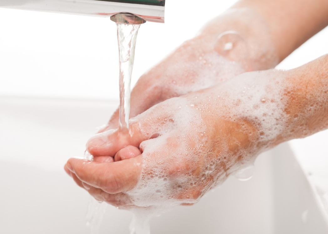 Male Hands Washing with Soap Bubbles